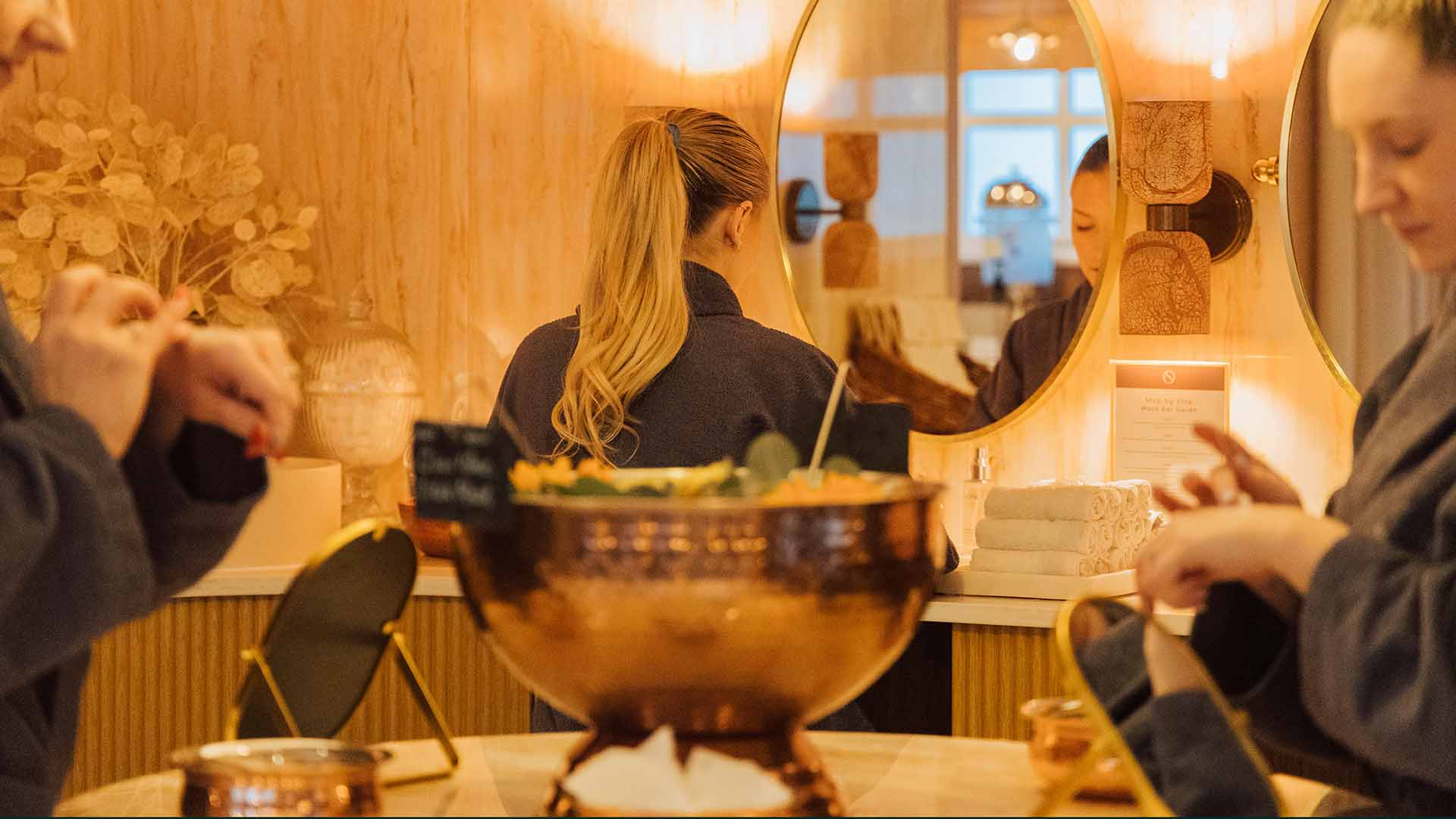 Three young women at the mask bar in the spa lounge
