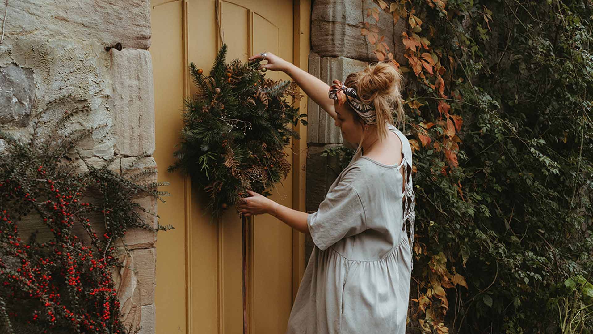 Hanging a Christmas wreath on a door