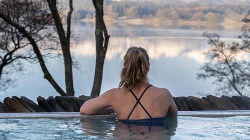 Young woman in the infinity pool