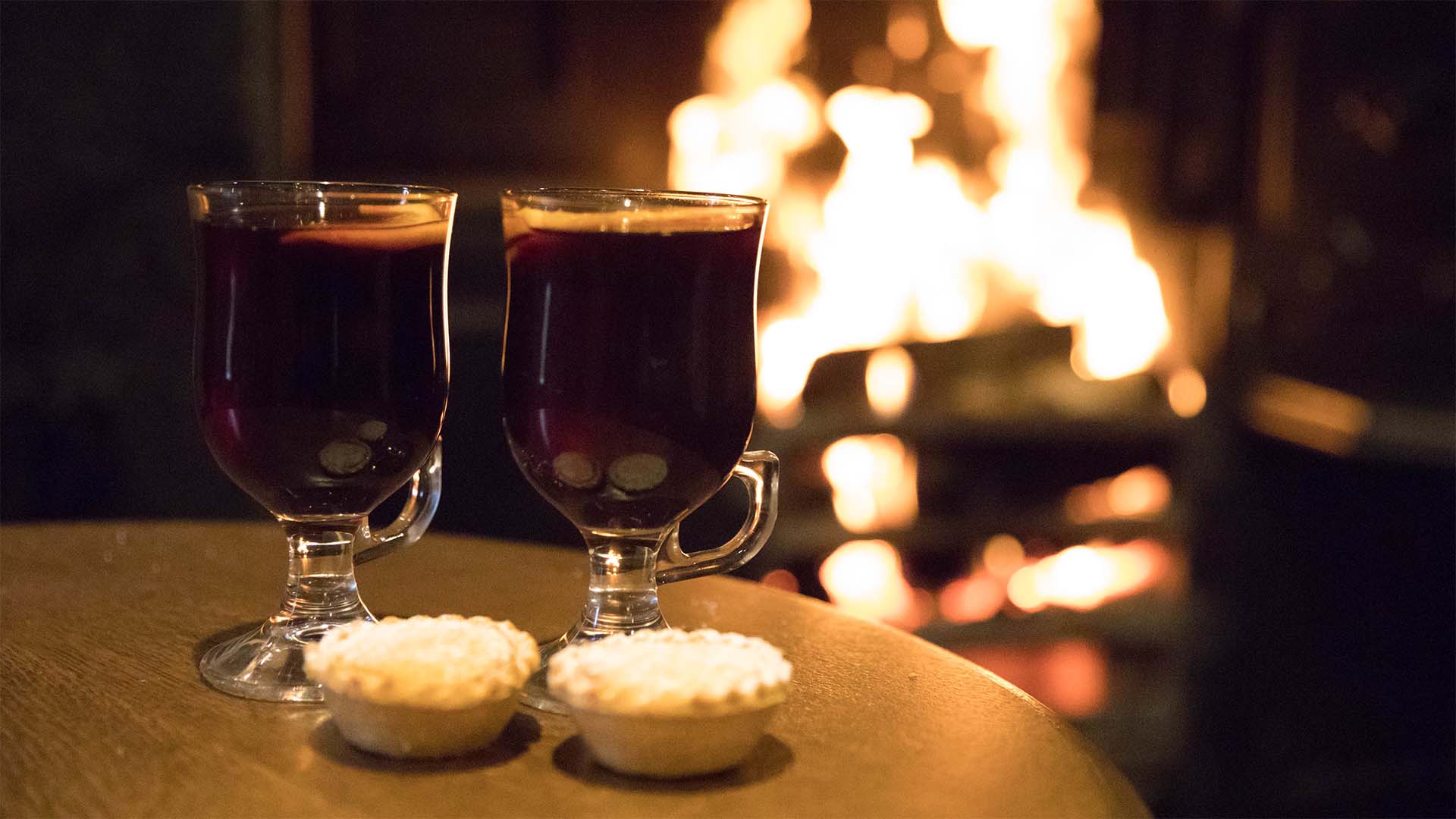 Mulled wine and mince pies by the open fire