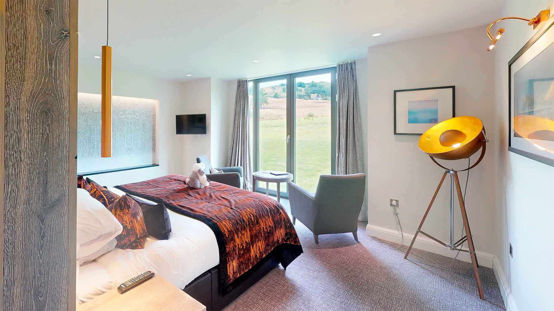 A Winander Club Lime bedroom at Low Wood Bay Resort & Spa