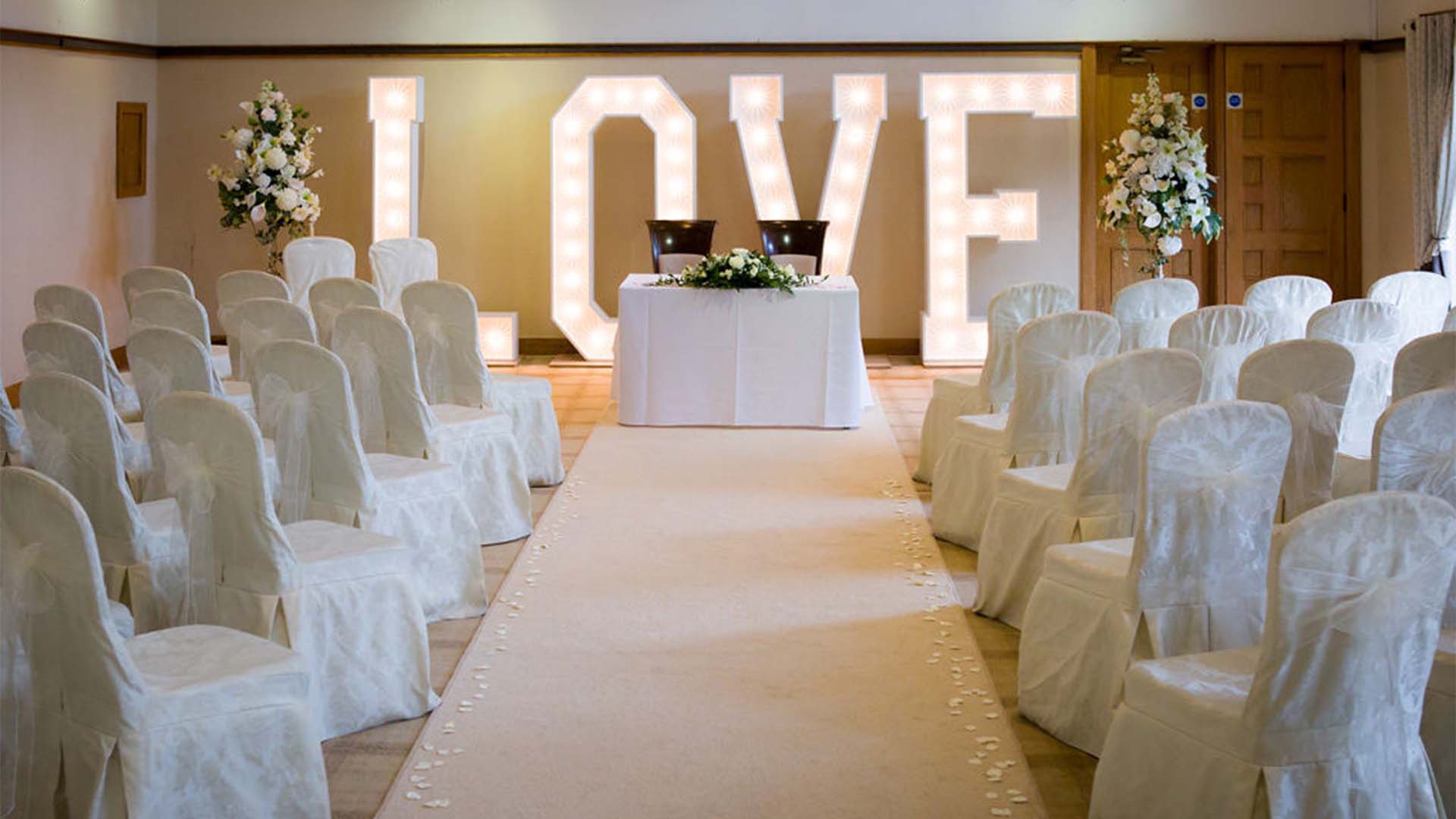 Dalton suite wedding ceremony setup with LOVE word prop