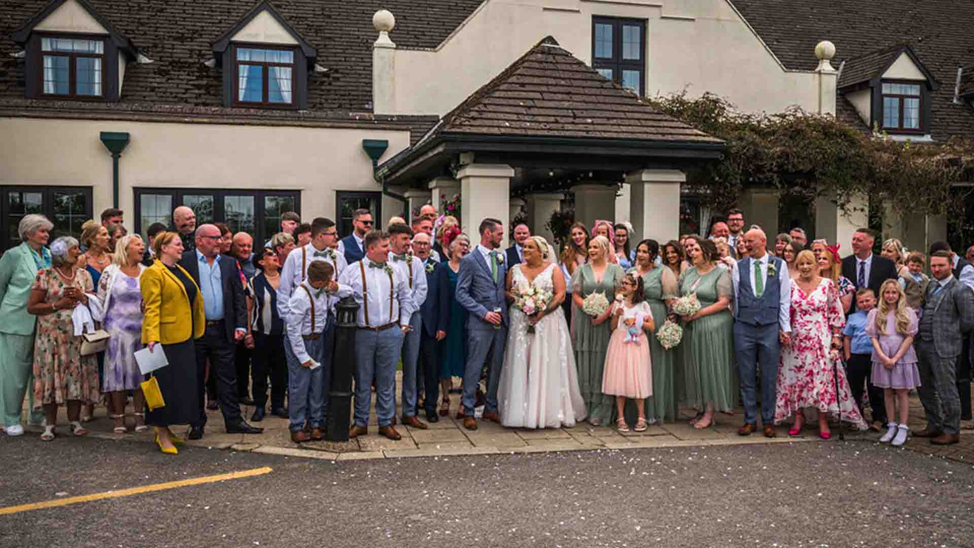 Wedding party by the entrance of Lancaster House Hotel
