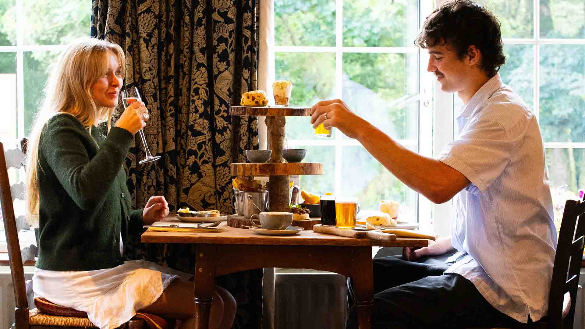 Couple in the restaurant enjoying an alternative afternoon tea