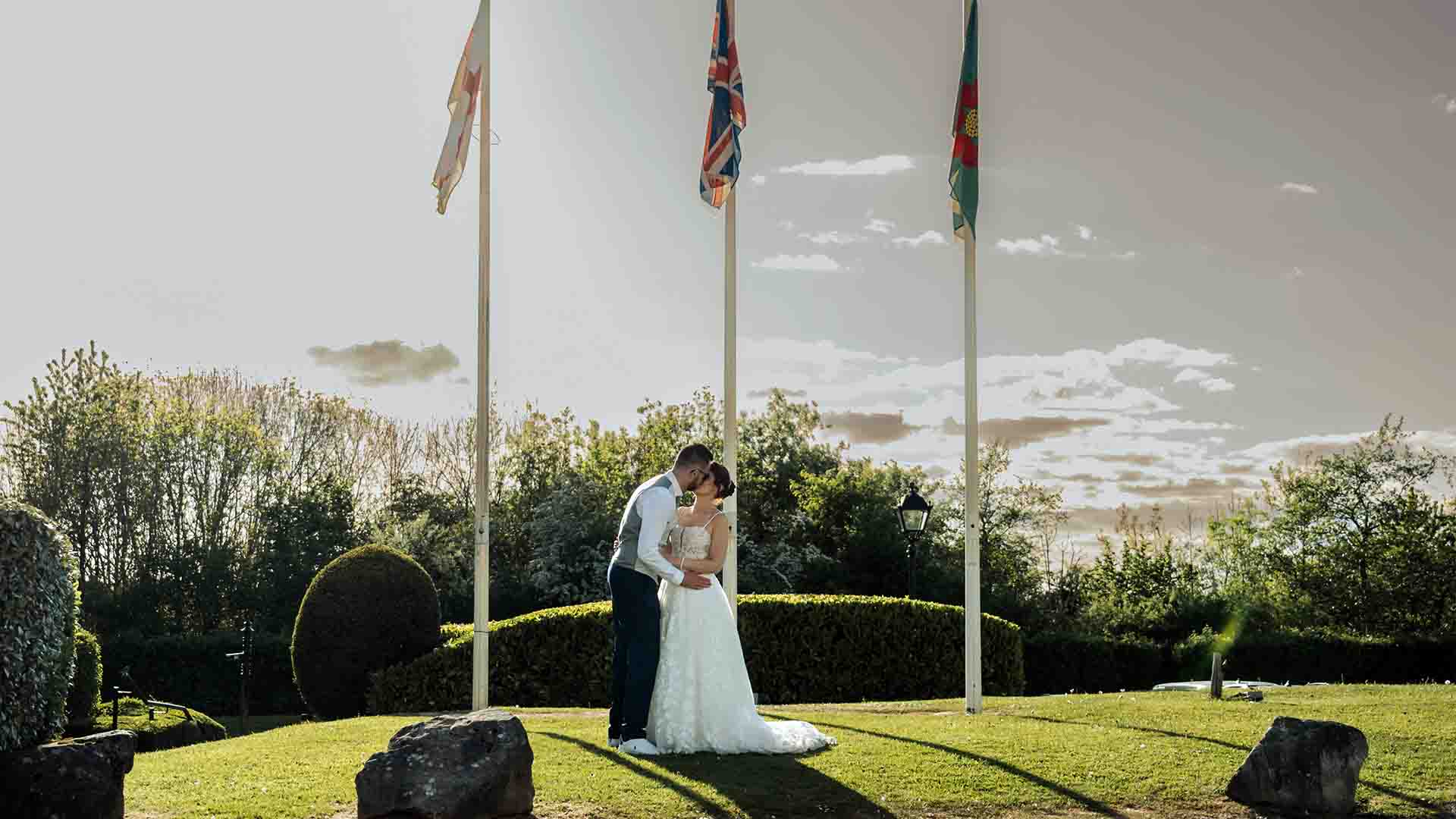 newly weds on the hotel lawns at Lancaster House Hotel