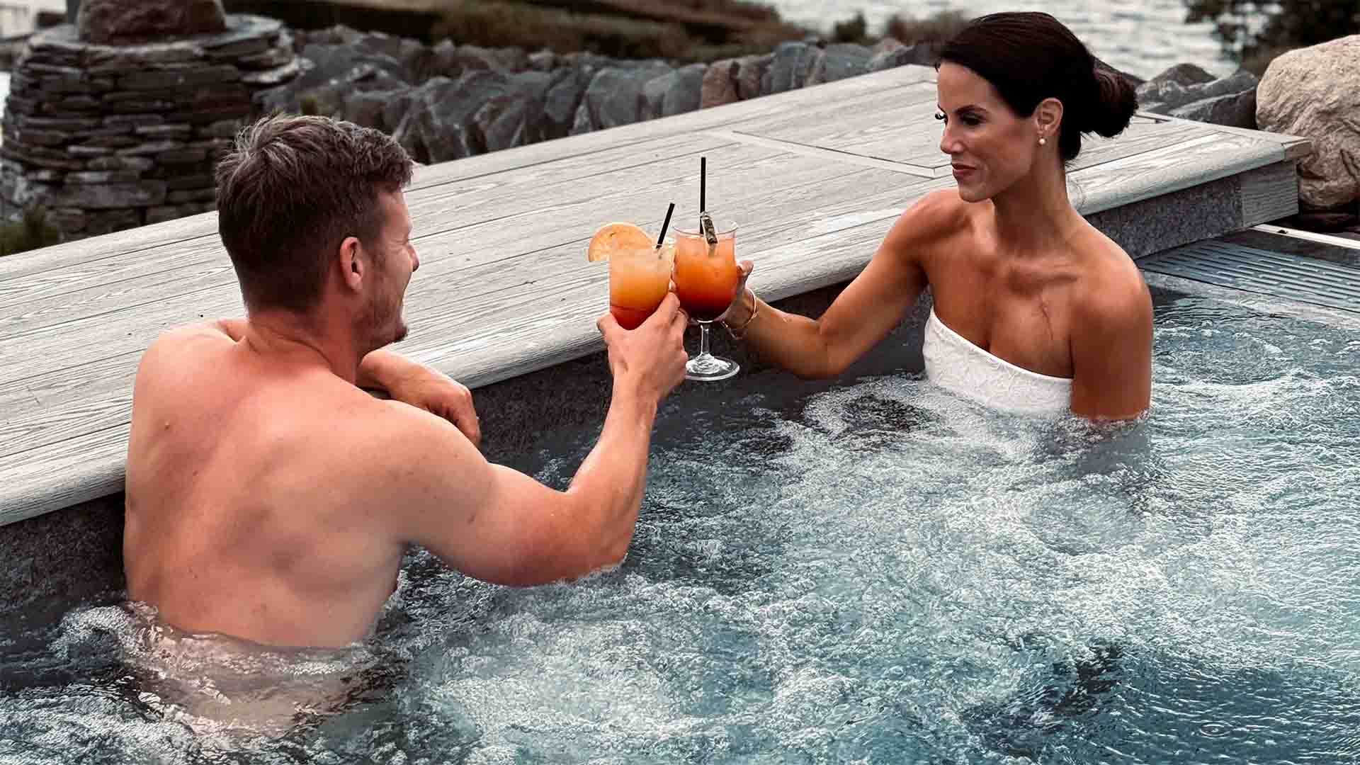 Couple looking out from the vitality pool