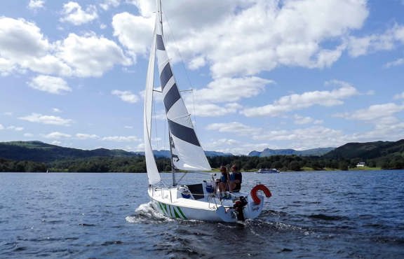 Keel sailing boat on lake Windermere on a bright sunny day