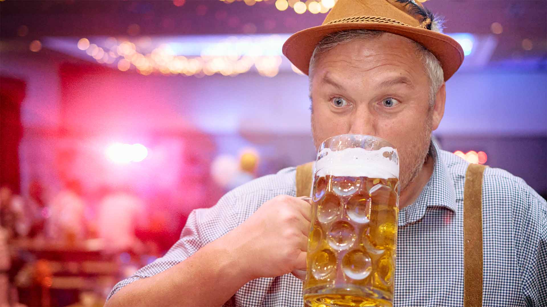 Festival goer enjoying a pint of beer at the Oktoberfest event