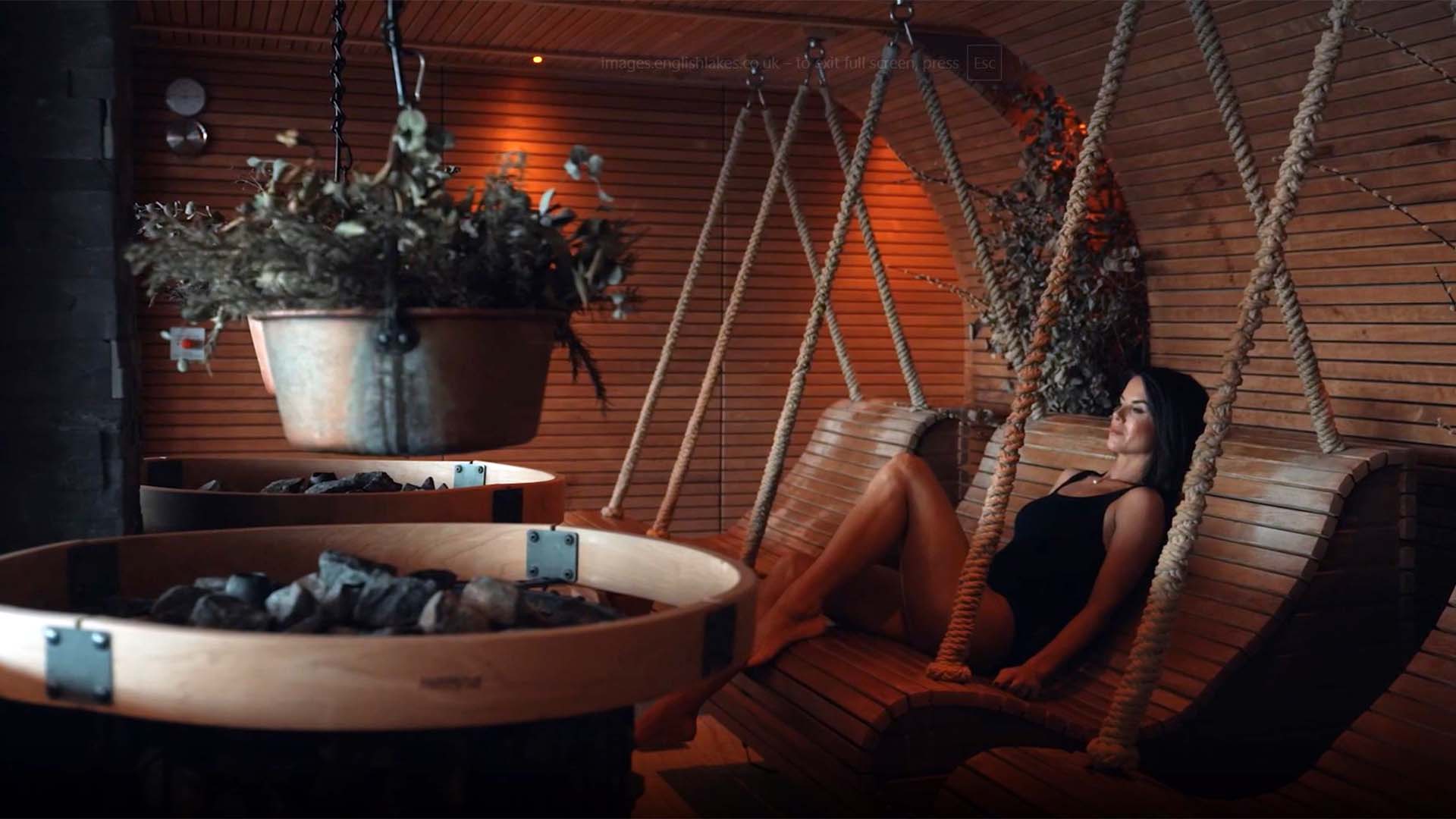 Young woman in the spa's herbal sauna