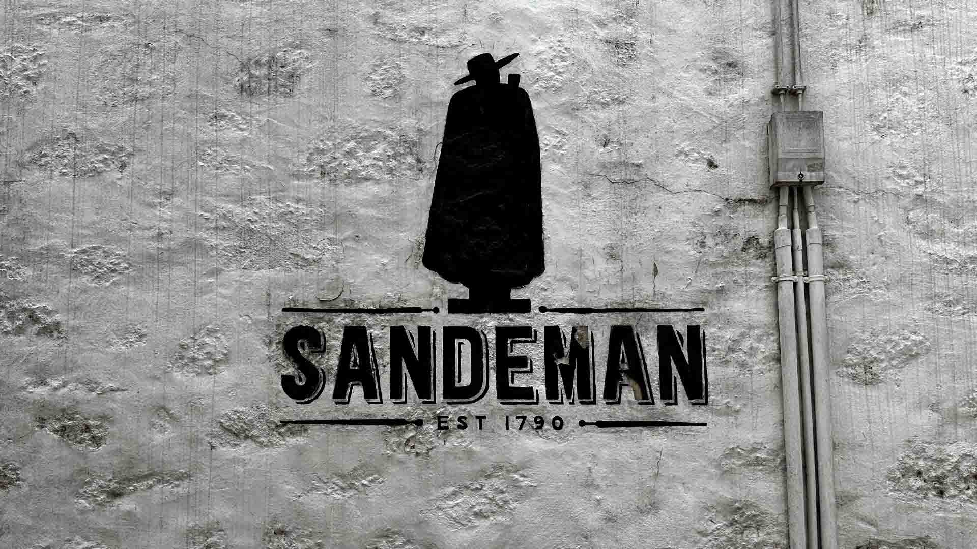 The Sandeman Logo on a wall