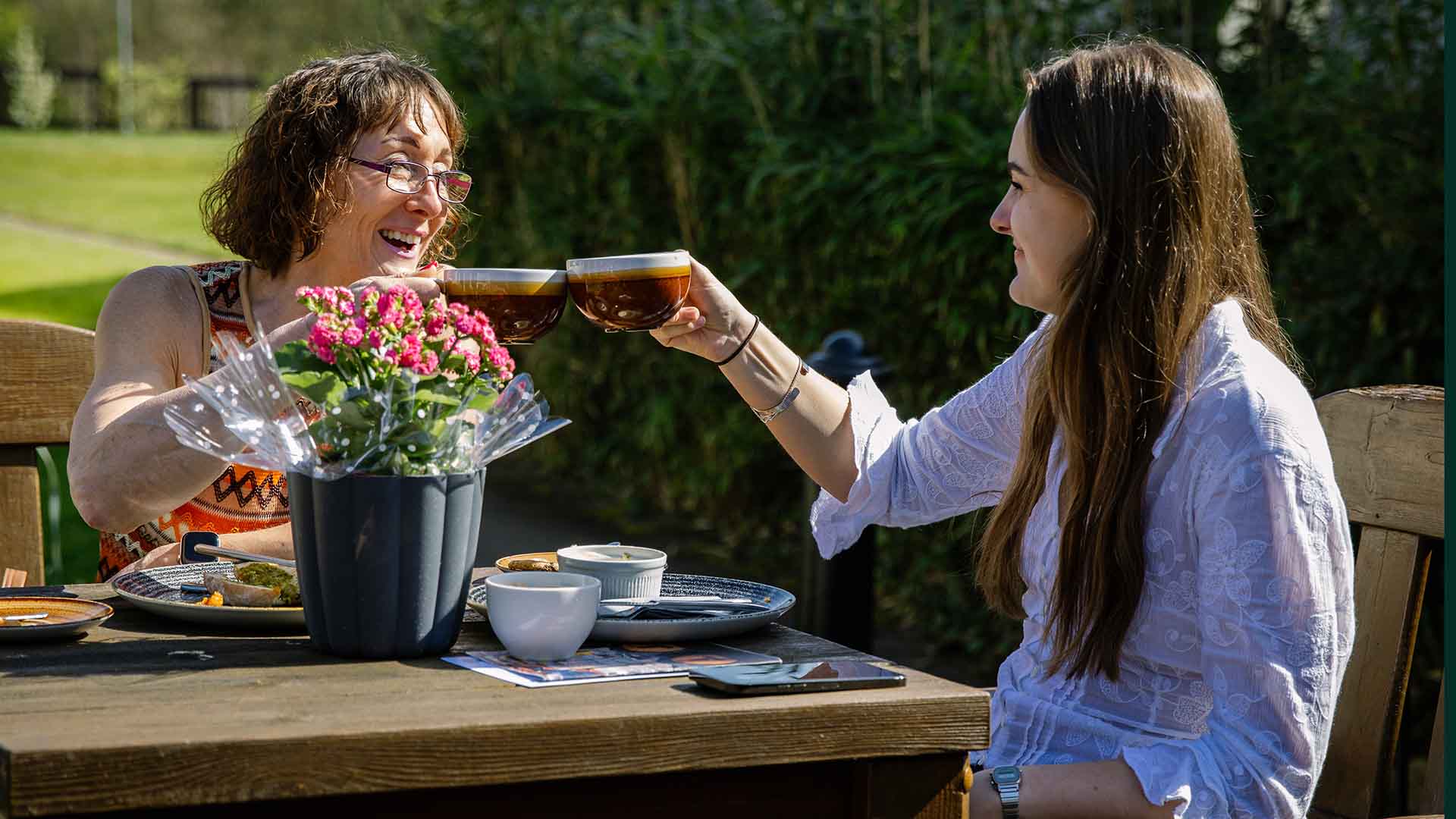 Couple raising a cup in the courtyard