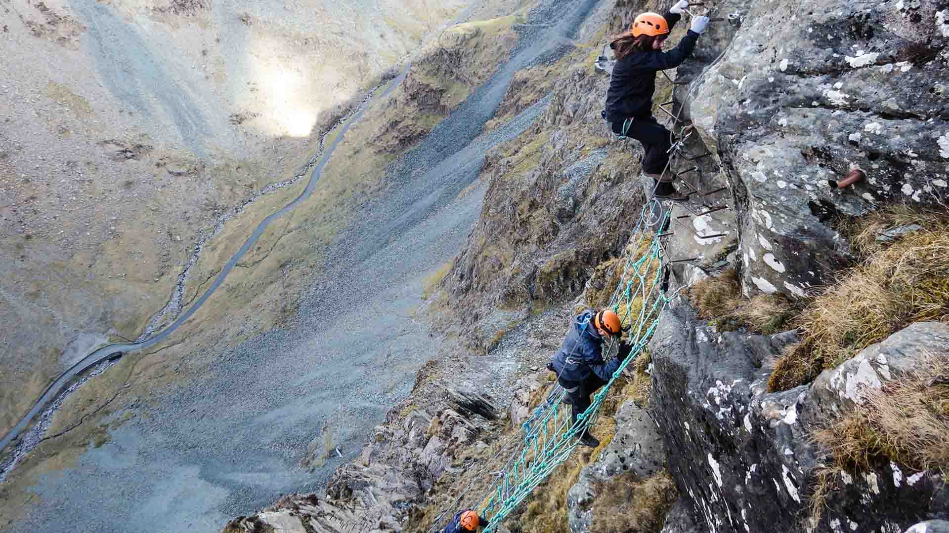 Looking down on climbers ascending the via ferrata