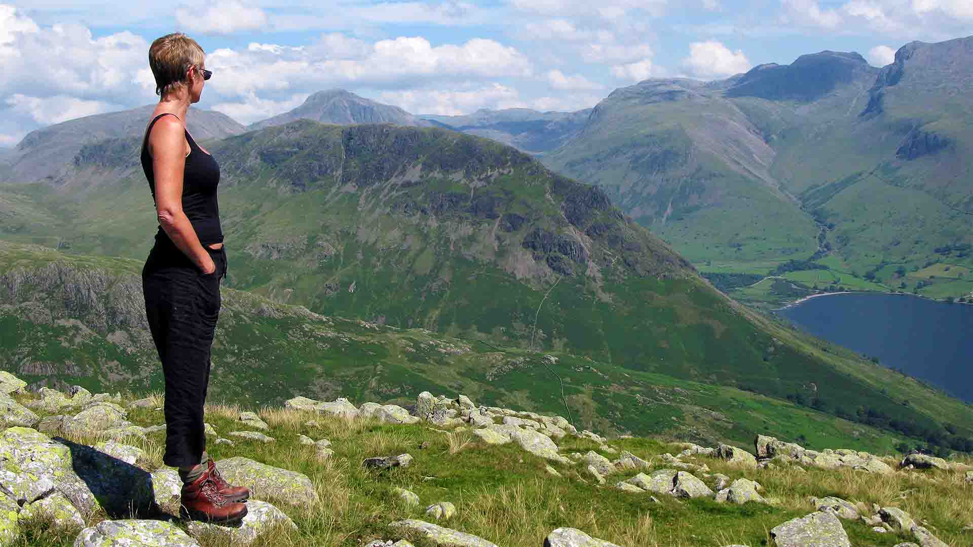 Walker looking out over Wastwater towards the Scafells