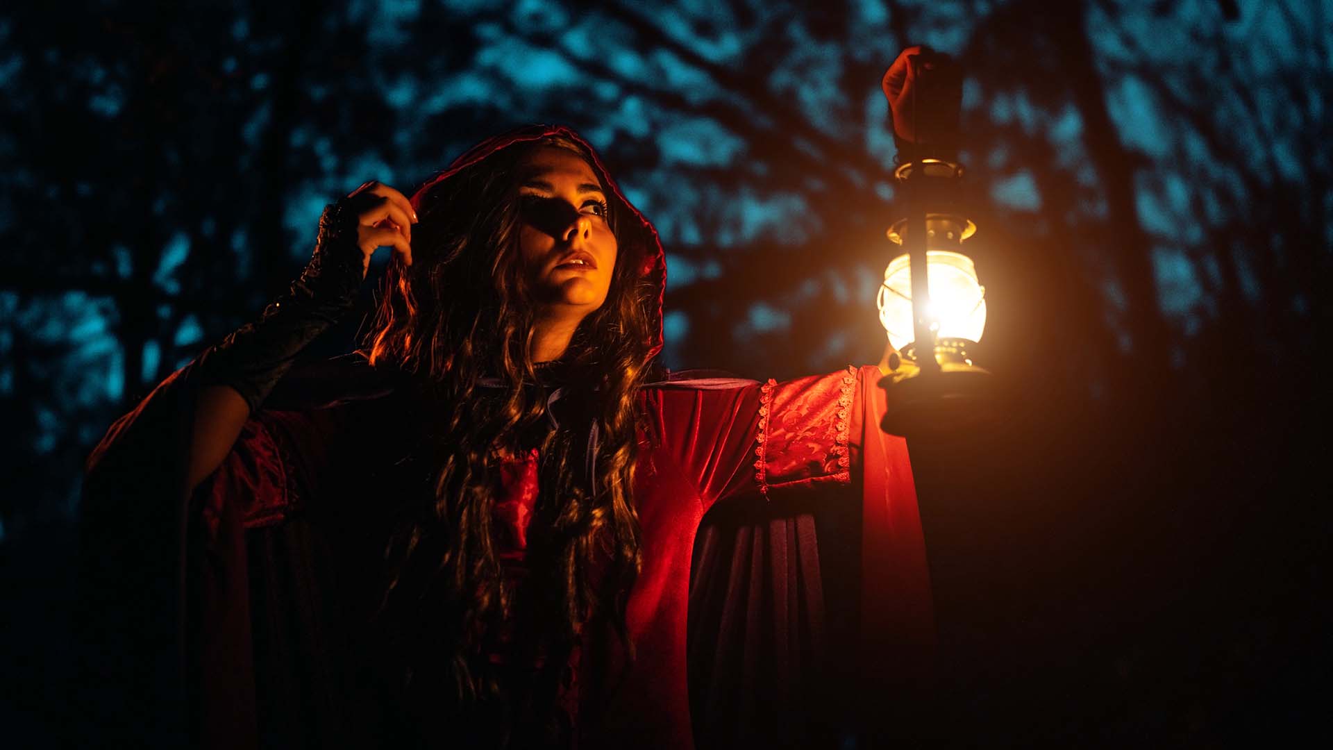 Young woman wearing a red cloak