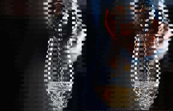 Pouring Prosecco from a bottle into a glass