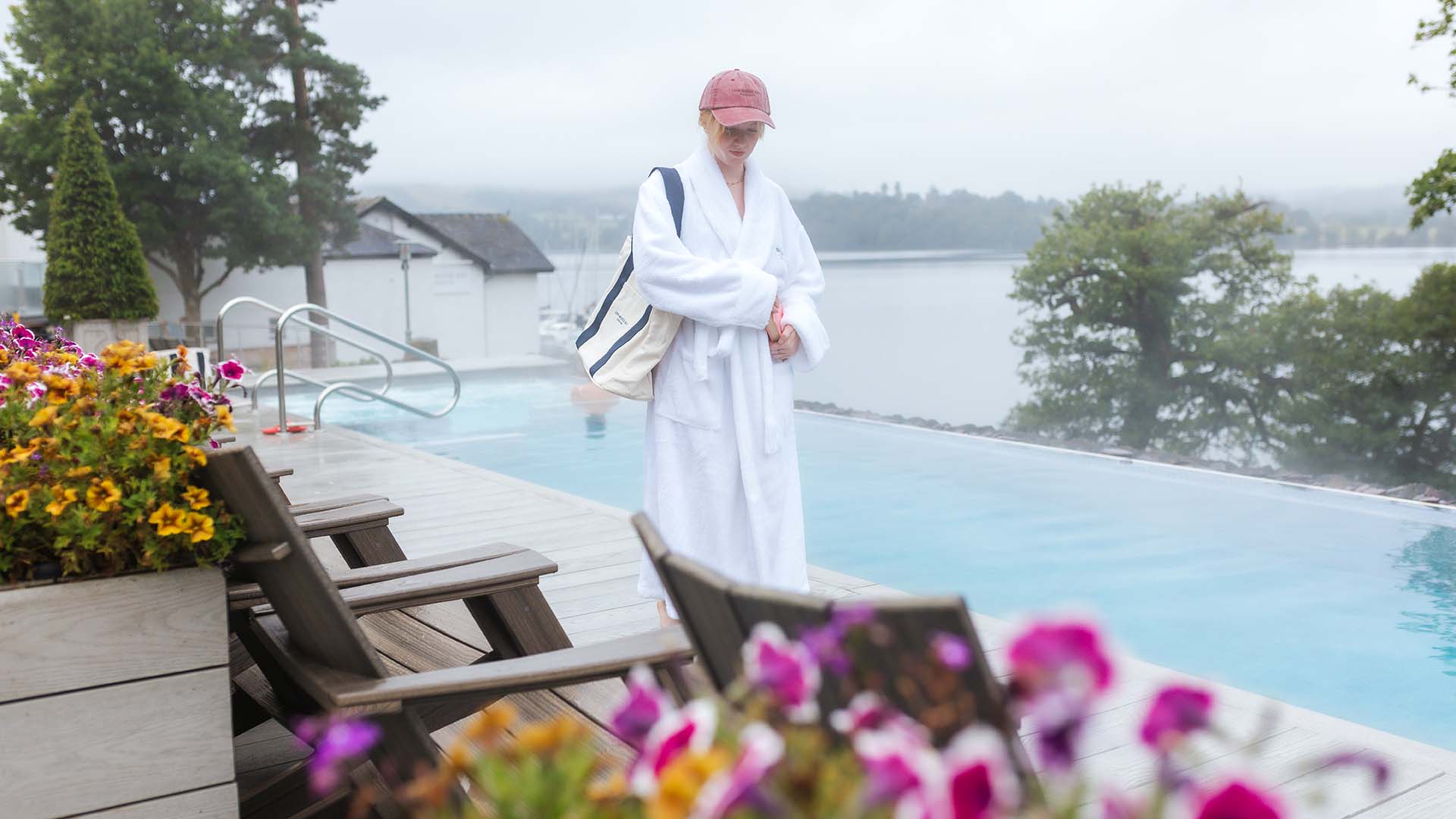 Young woman walking by the side of the vitality pool