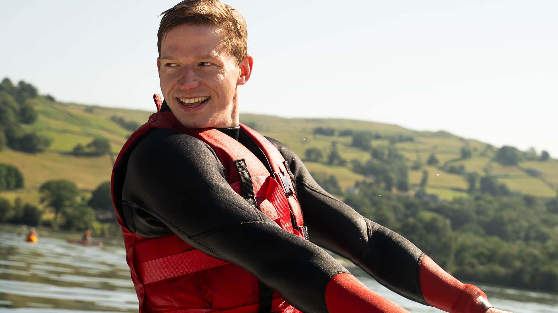 Young man learning to waterski on Lake Windermere