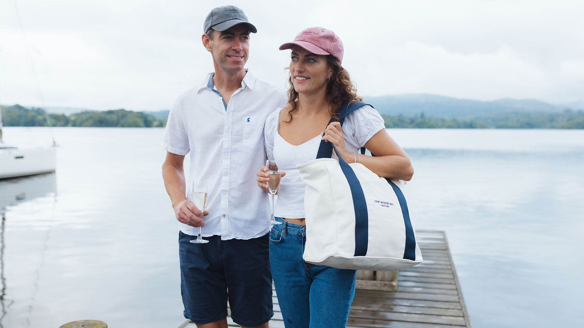 Couple walking along the jetty