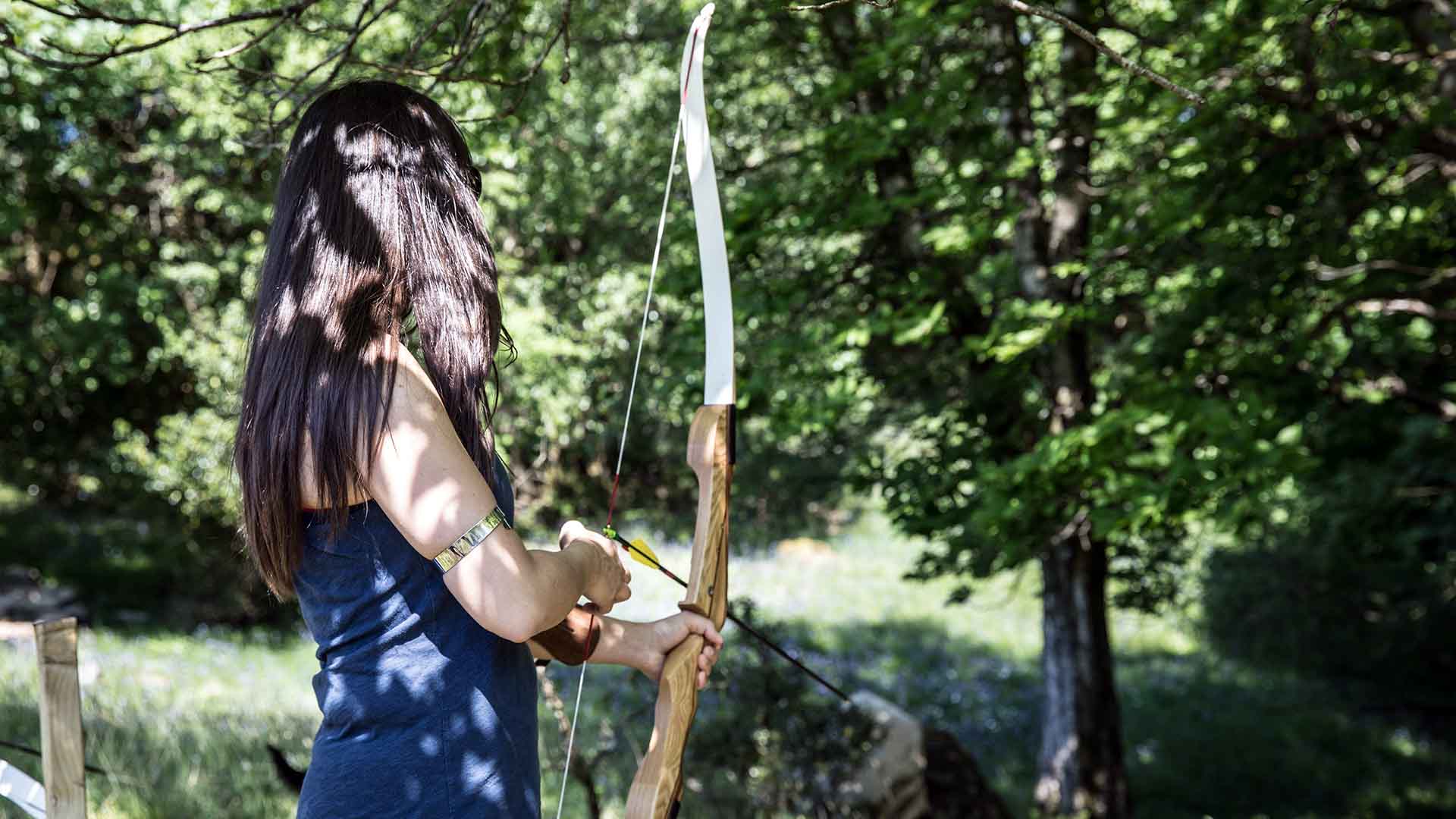 Young woman taking part in an archery session