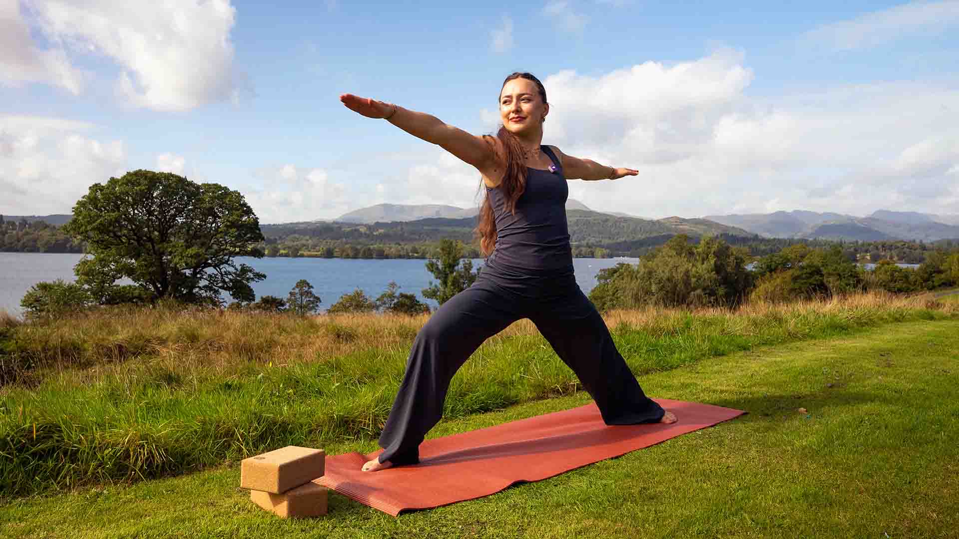 Millie the yoga instructor in a stretch type pose