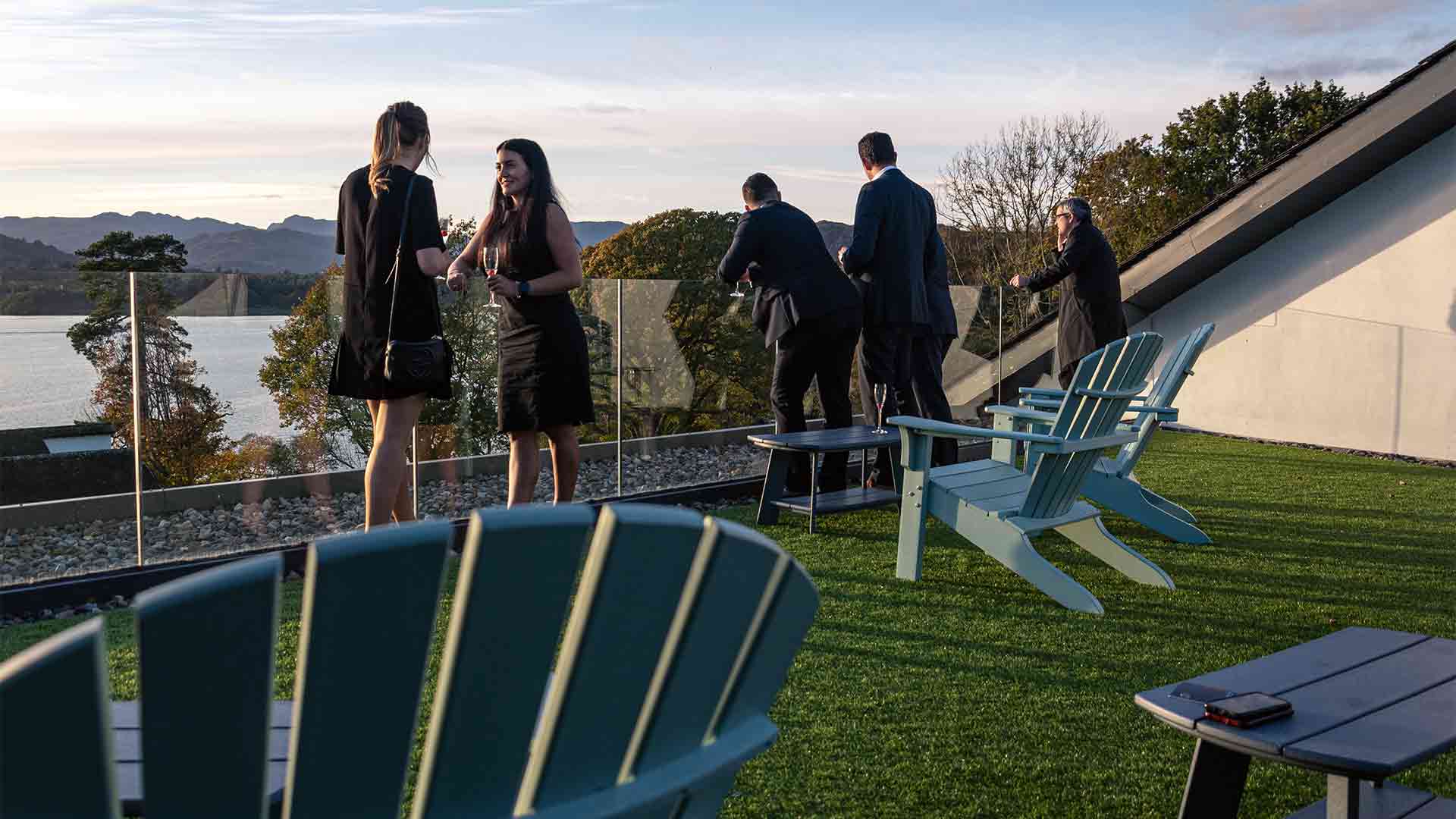 Group looking out over lake Windermere from the roof terrace