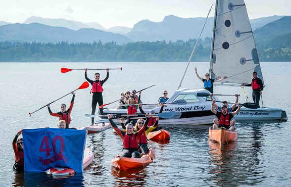 people on waterspouts equipment celebrating 40 years