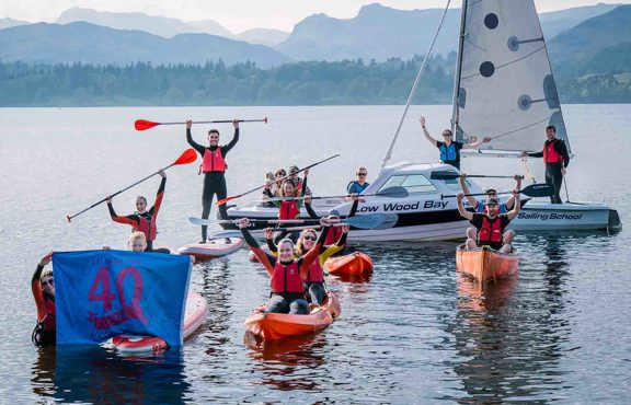 people on waterspouts equipment celebrating 40 years