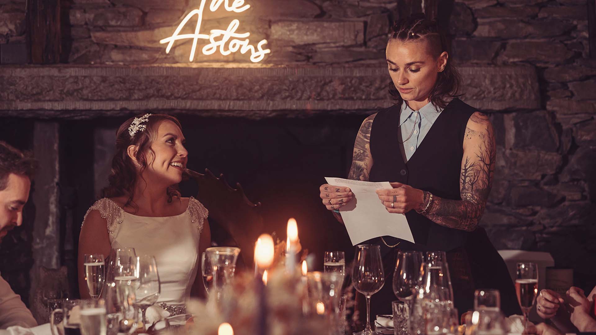 Newly wed couple at their wedding breakfast at Wild Boar Estate.